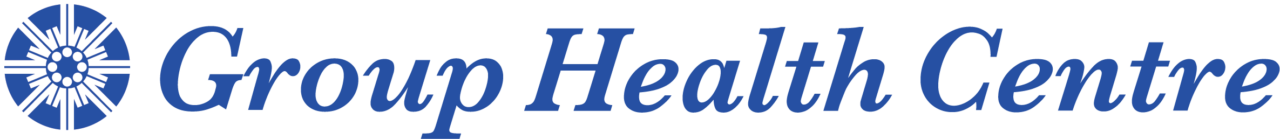 Blue Group Health Centre Logo - White wheel to the left of the text