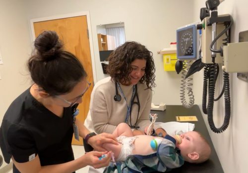 NP Bazely with patient receiving immunization against RSV